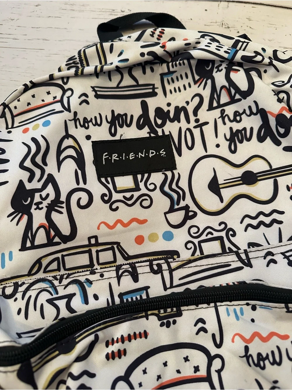 FRIENDS White Backpack with Black Accents and Multicolor Doodles